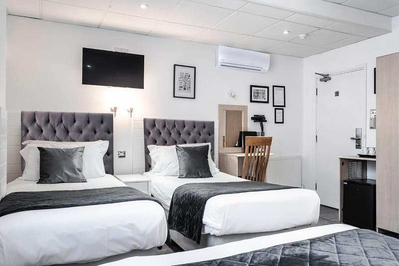 Classic Family Room for four — the beds, the desk and the television