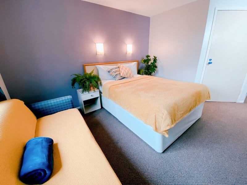 King-size bed with a sofa bed in the foreground