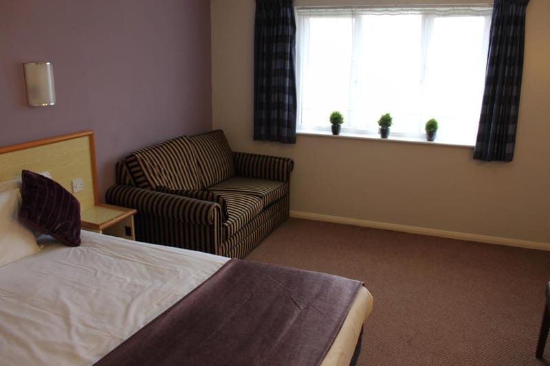 King Room with bed and sofa