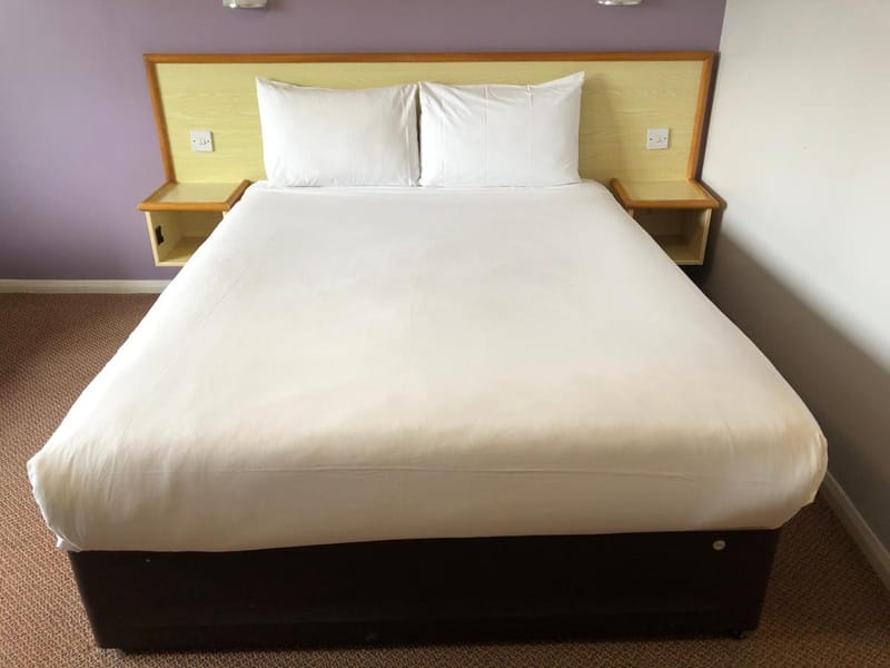 King-size bed with white linen