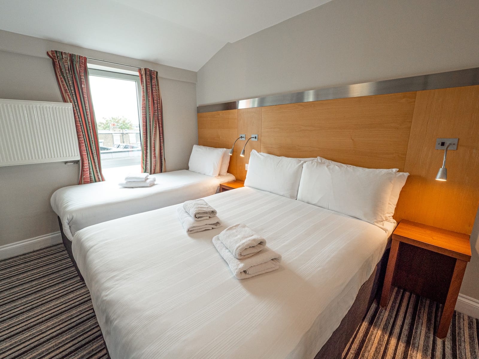 Triple room at Maiden Oval, with a double bed and a single bed