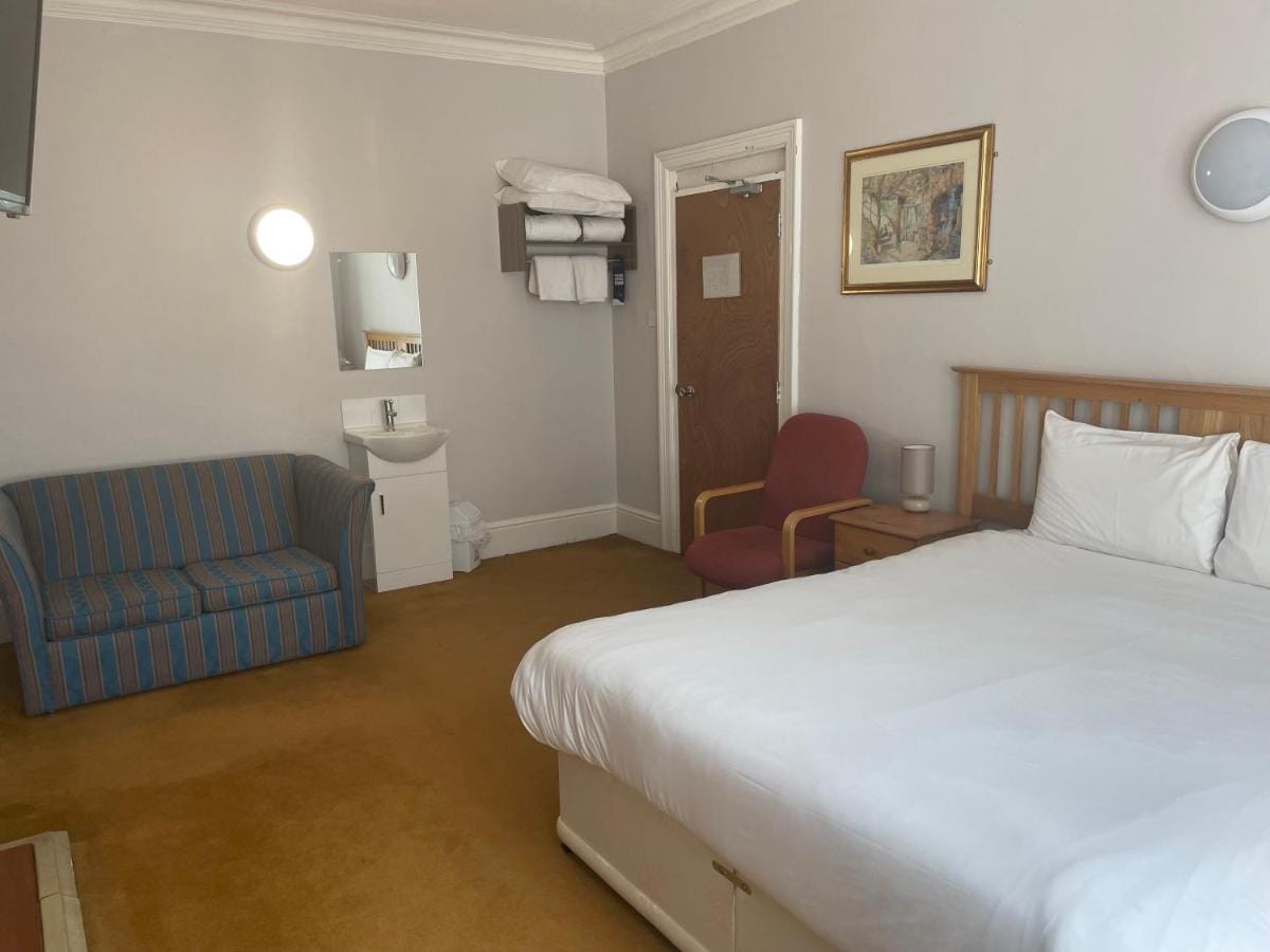 Family room with a double bed and sofa