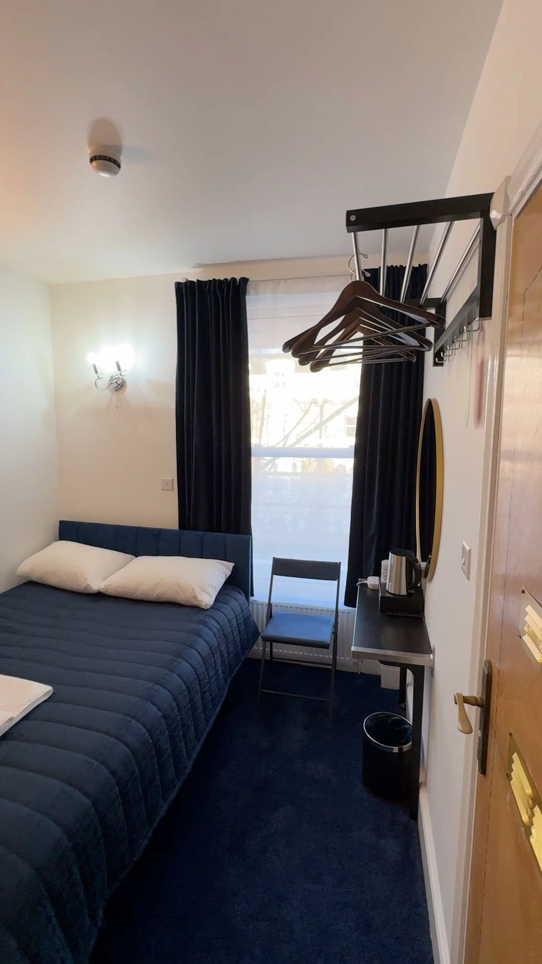 Economy Double — a double bed under the window