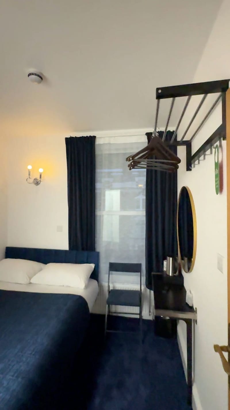Economy Double — the bed, hanging rail and mirror