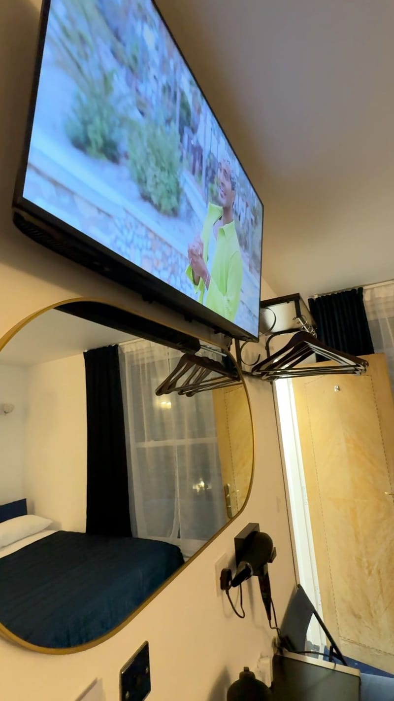 Triple Room — television, mirror and hanging rail