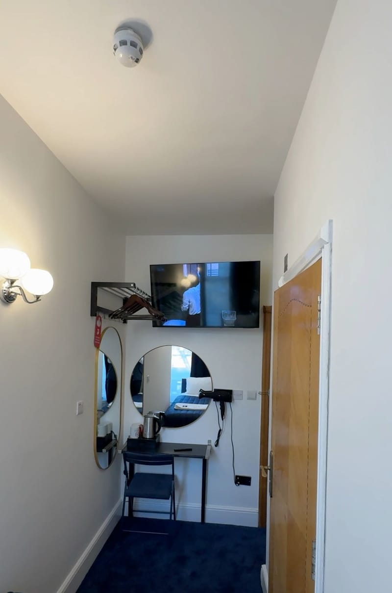 Single Room — desk, mirrors and television