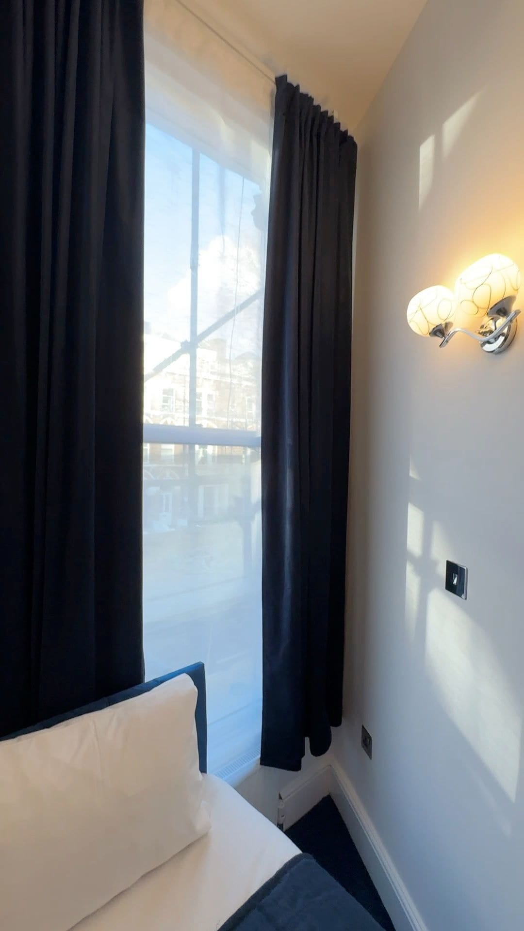 Single Room — a single bed by the window