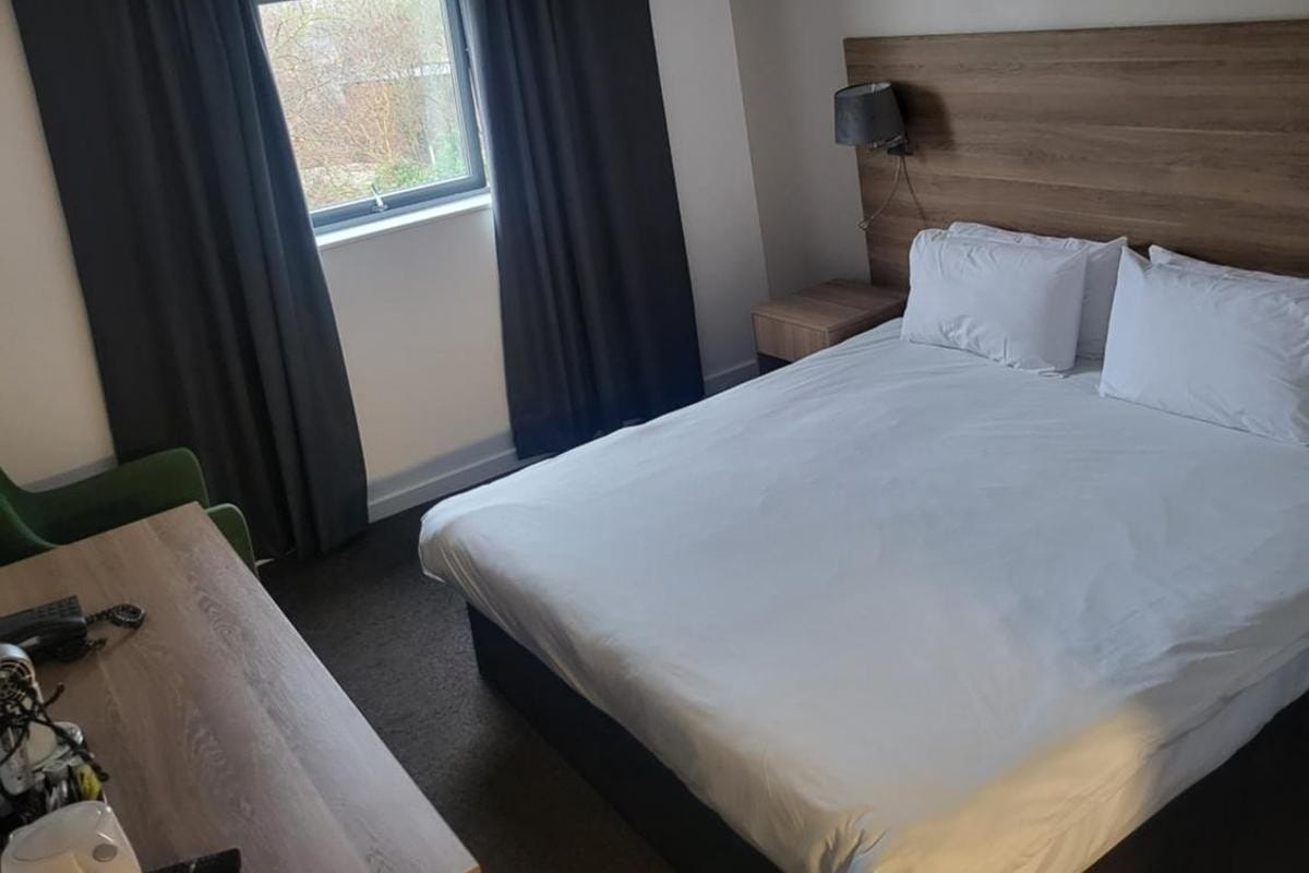 Double bed, desk and window