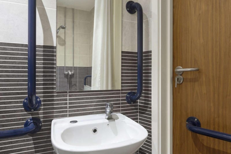 Accessible basin with grab rails