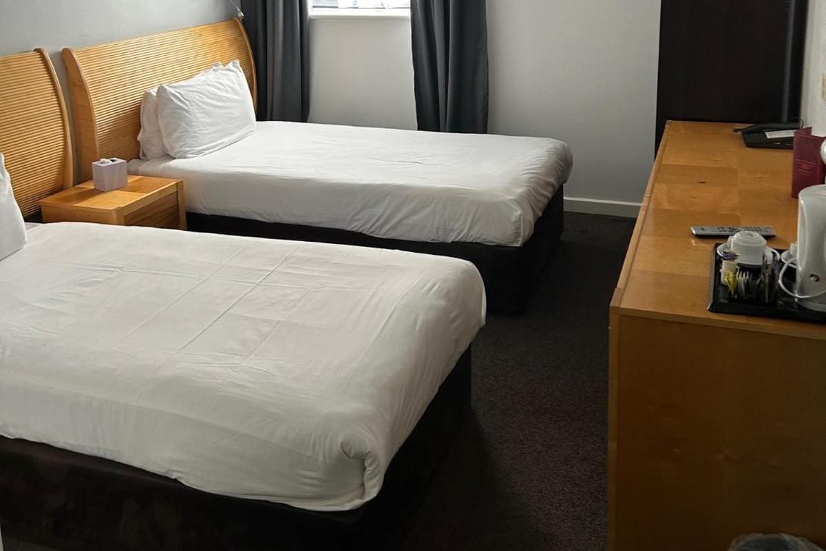 Two single beds by the window