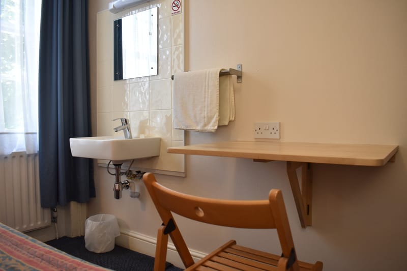 Single room with shared bathroom — washbasin and desk