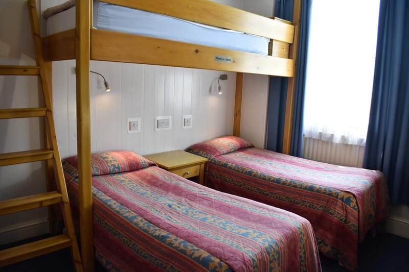 Triple room with its own bathroom — bunk over a single bed
