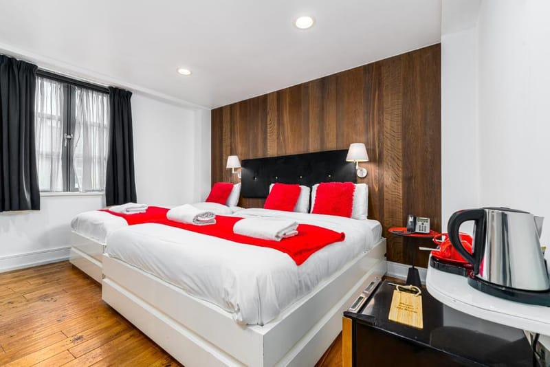 The extra-large double bed and walnut panelling in a Luxury Double Room