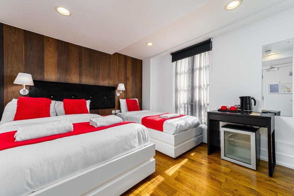 A Classic Triple Room, with a double bed and a single bed