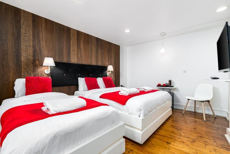 The double and single beds of a Classic Triple Room