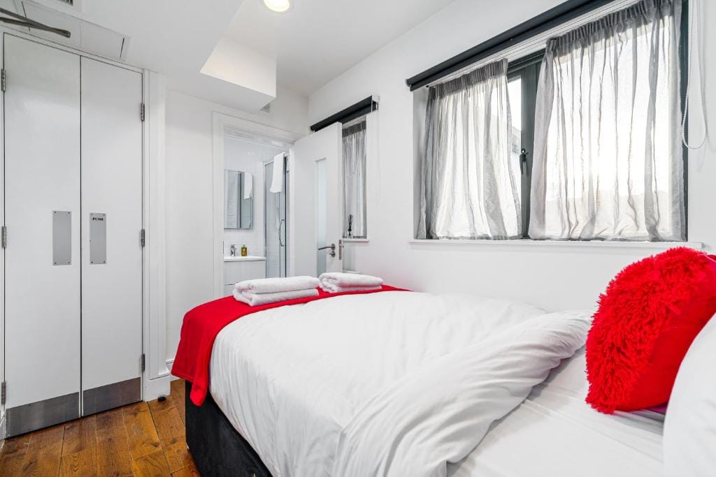 A Standard Double Room, with a double bed and fitted wardrobes