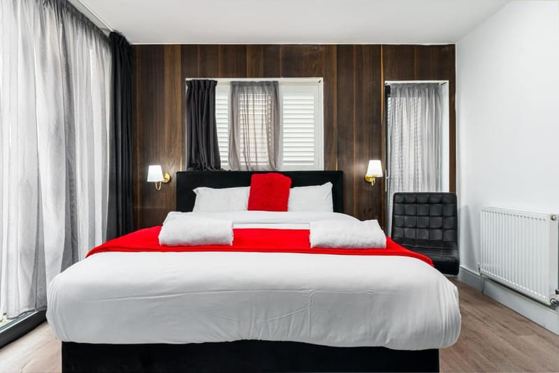 The double bed and window of a Superior Double Room