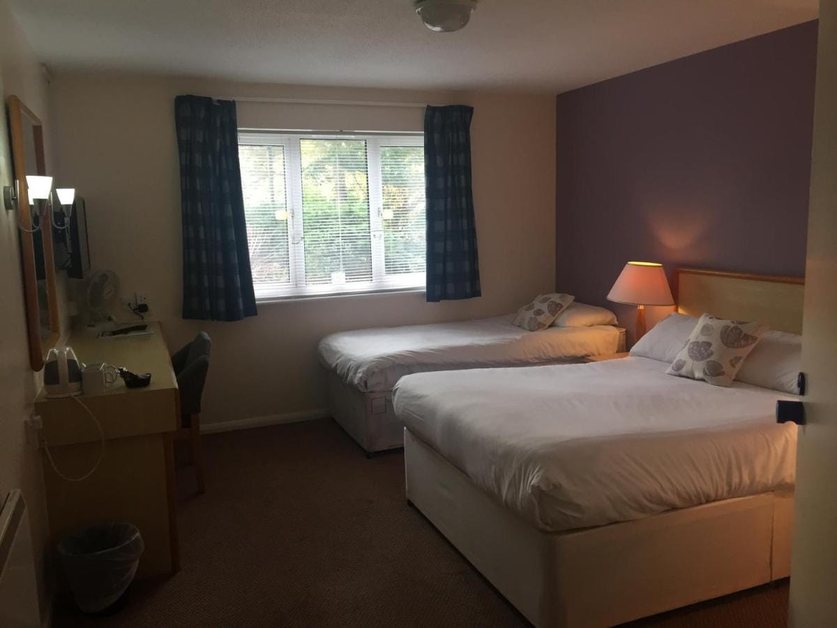 Accessible room with a double and a single bed