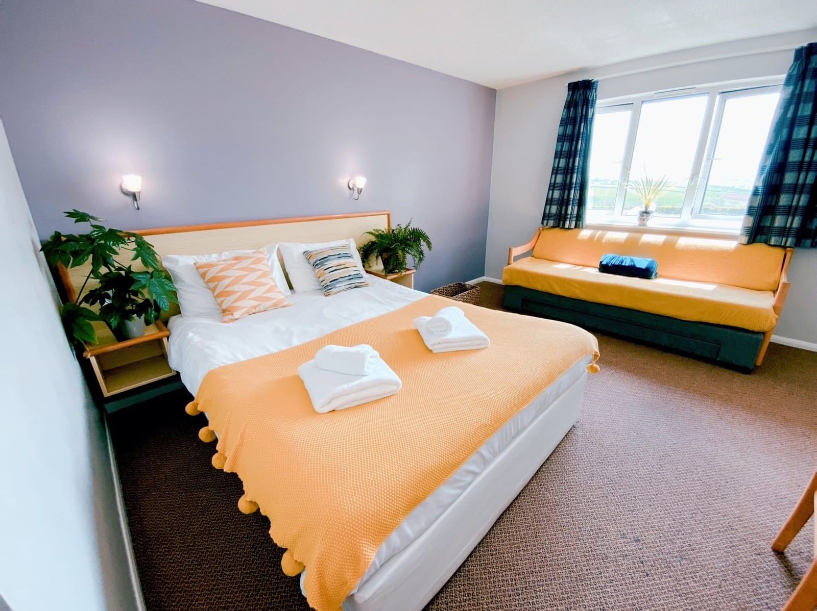 King-size bed with the sofa bed by the window