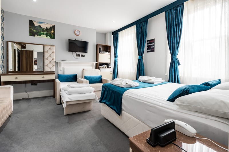 Quad Room with a double bed and two single beds
