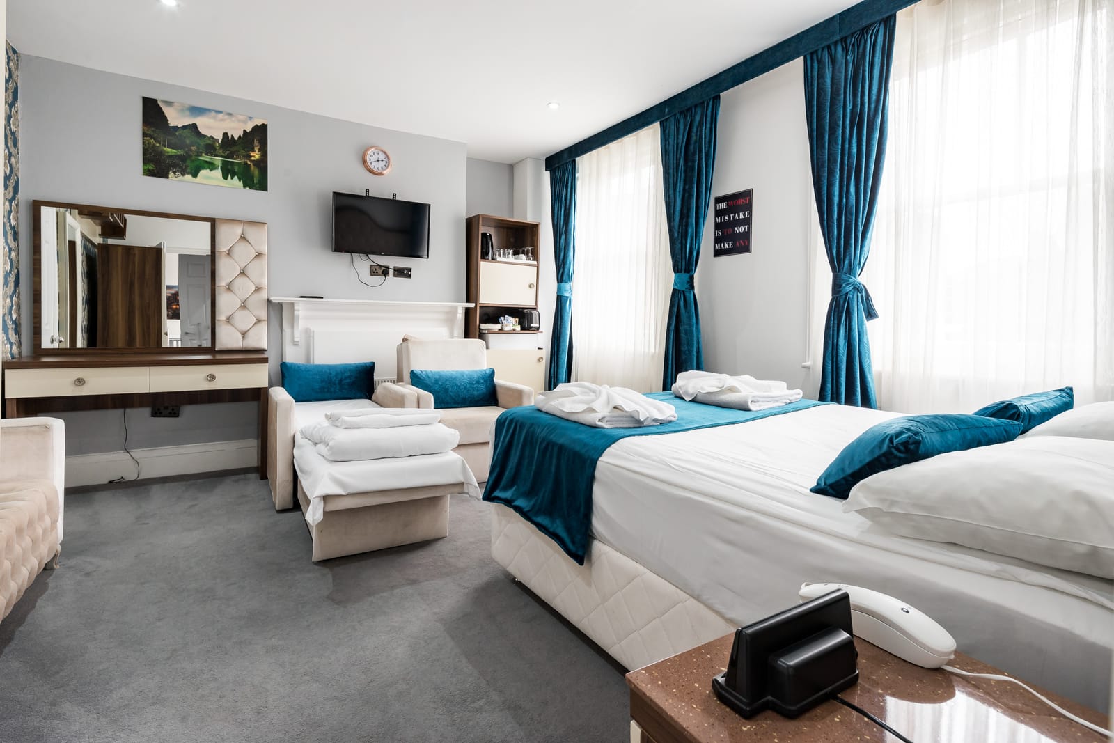 Quad Room with a double bed and two single beds
