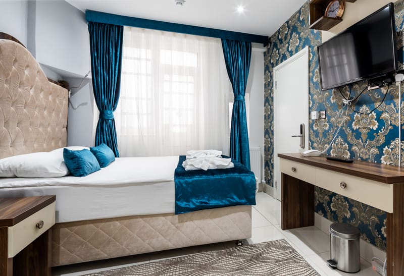 Double Room with a work desk and flat-screen television