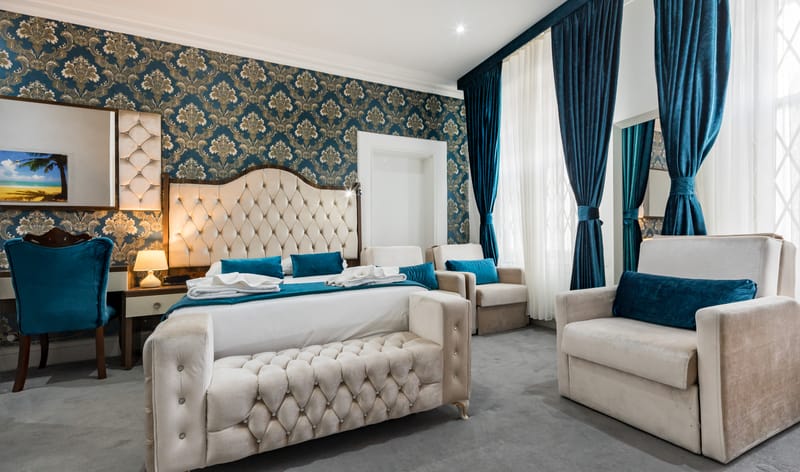 Family Room with a double bed, sofa and armchair